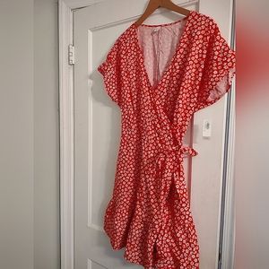 Red with white flowers wrap dress linen material, ruffled bottom.